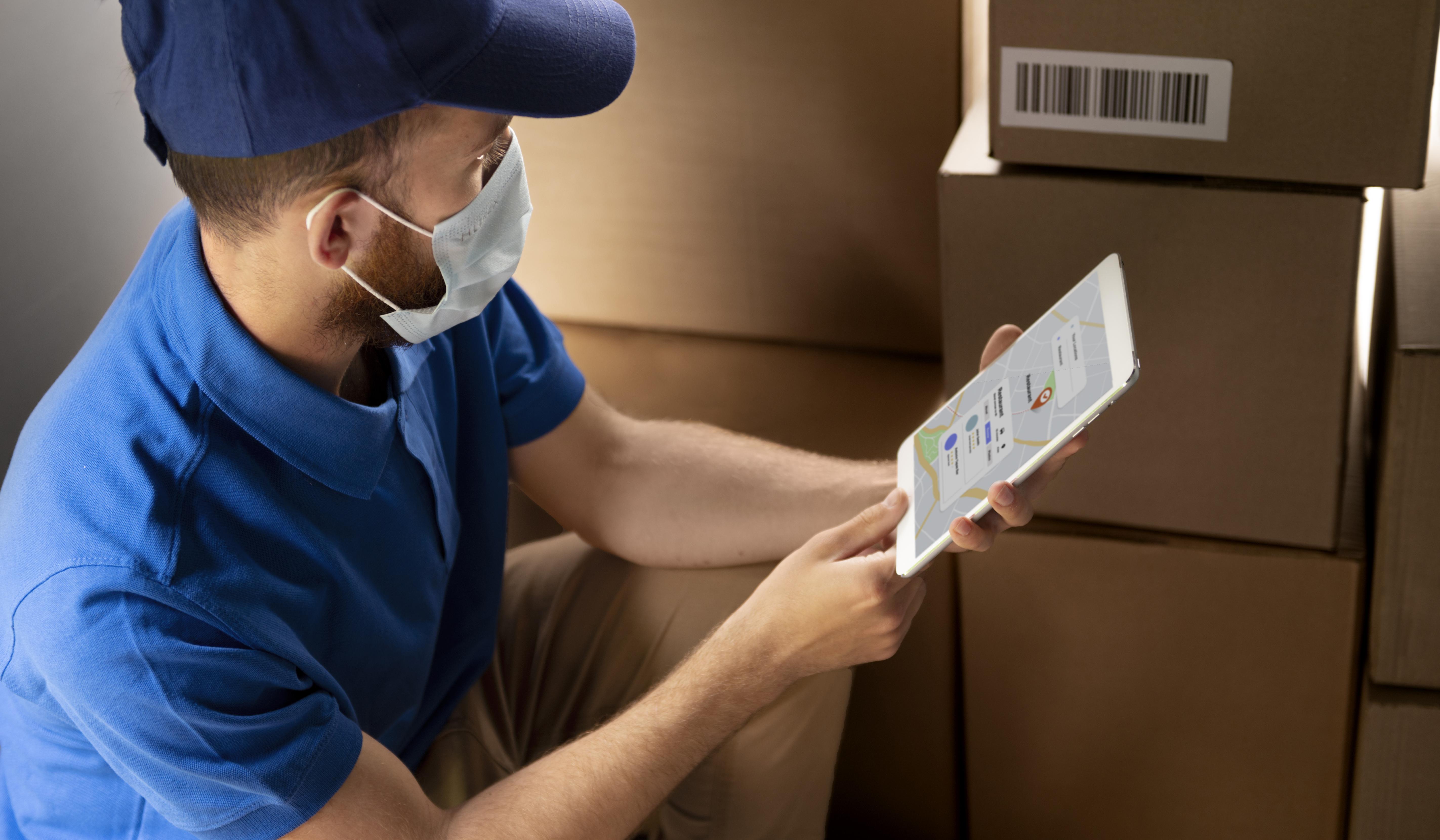 man managing warehouse inventory using vendor management systems man managing warehouse inventory using vendor management systems