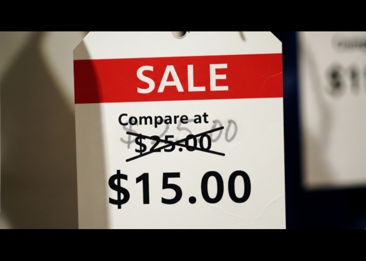 retail price tag showing compare at price crossed out next to discounted price
