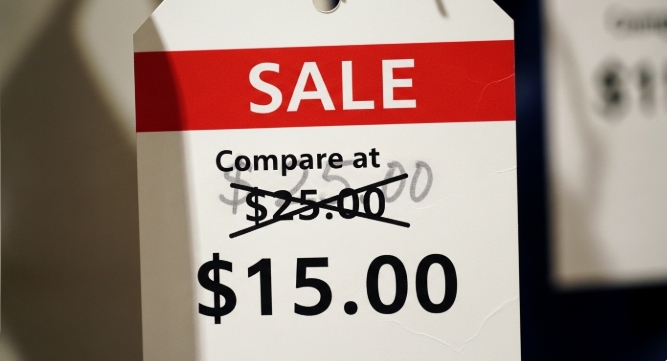 retail price tag showing compare at price crossed out next to discounted price